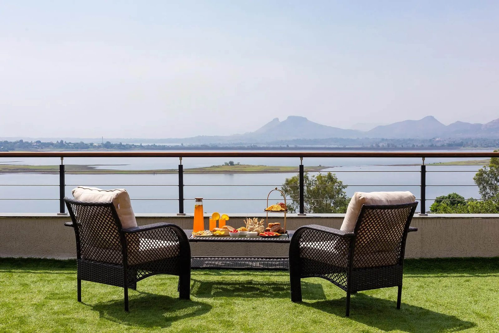 LAWN + BBQ – Lawn at golden hour, jogging track curving, BBQ smoke.